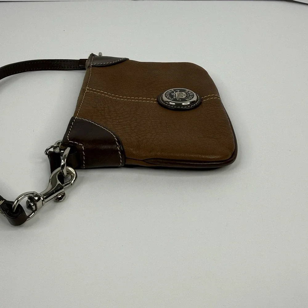 Dooney & Bourke Brown Pebble Leather Wristlet Medallion Logo Zipper